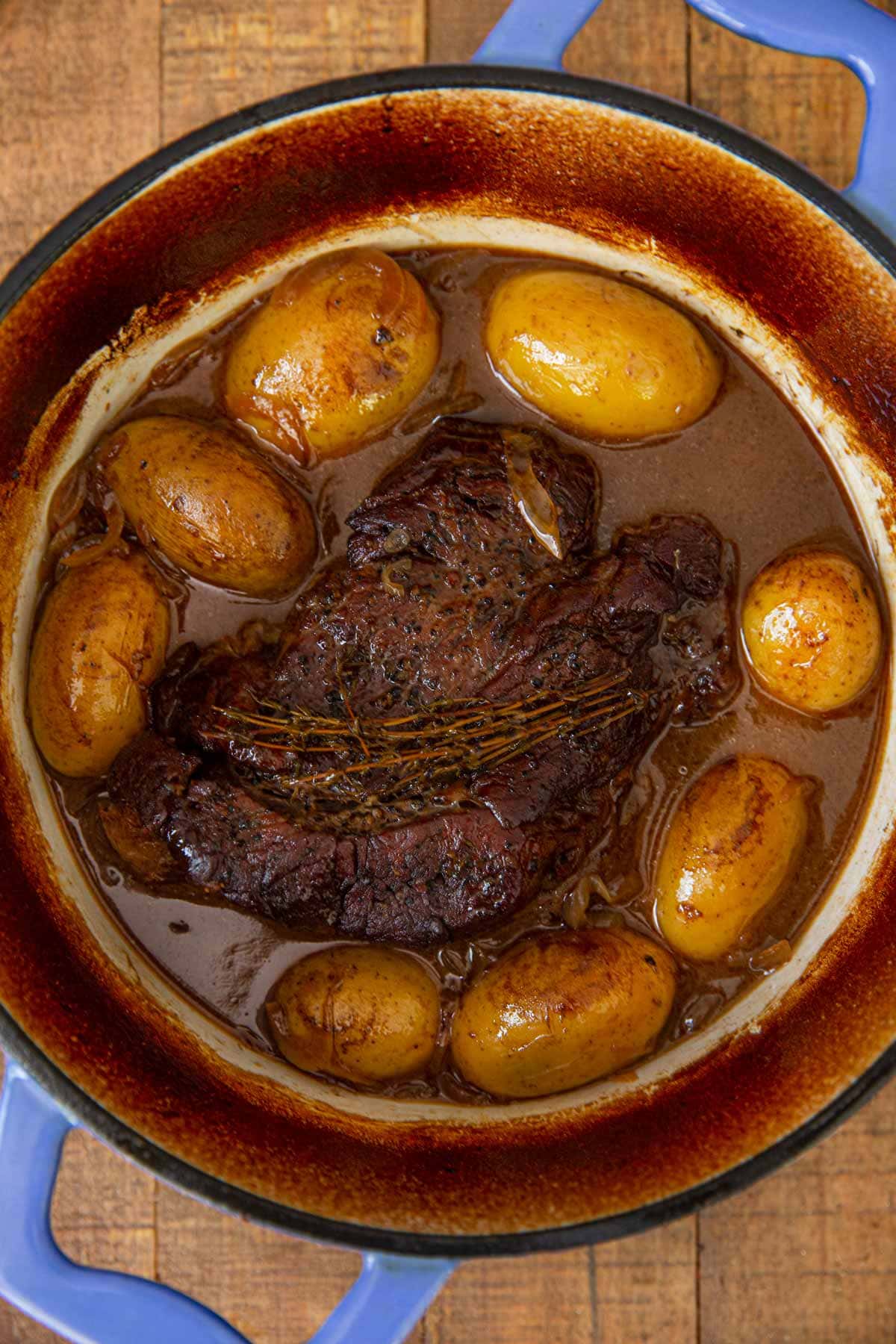 Steakhouse Pot Roast in blue pot before cream being added