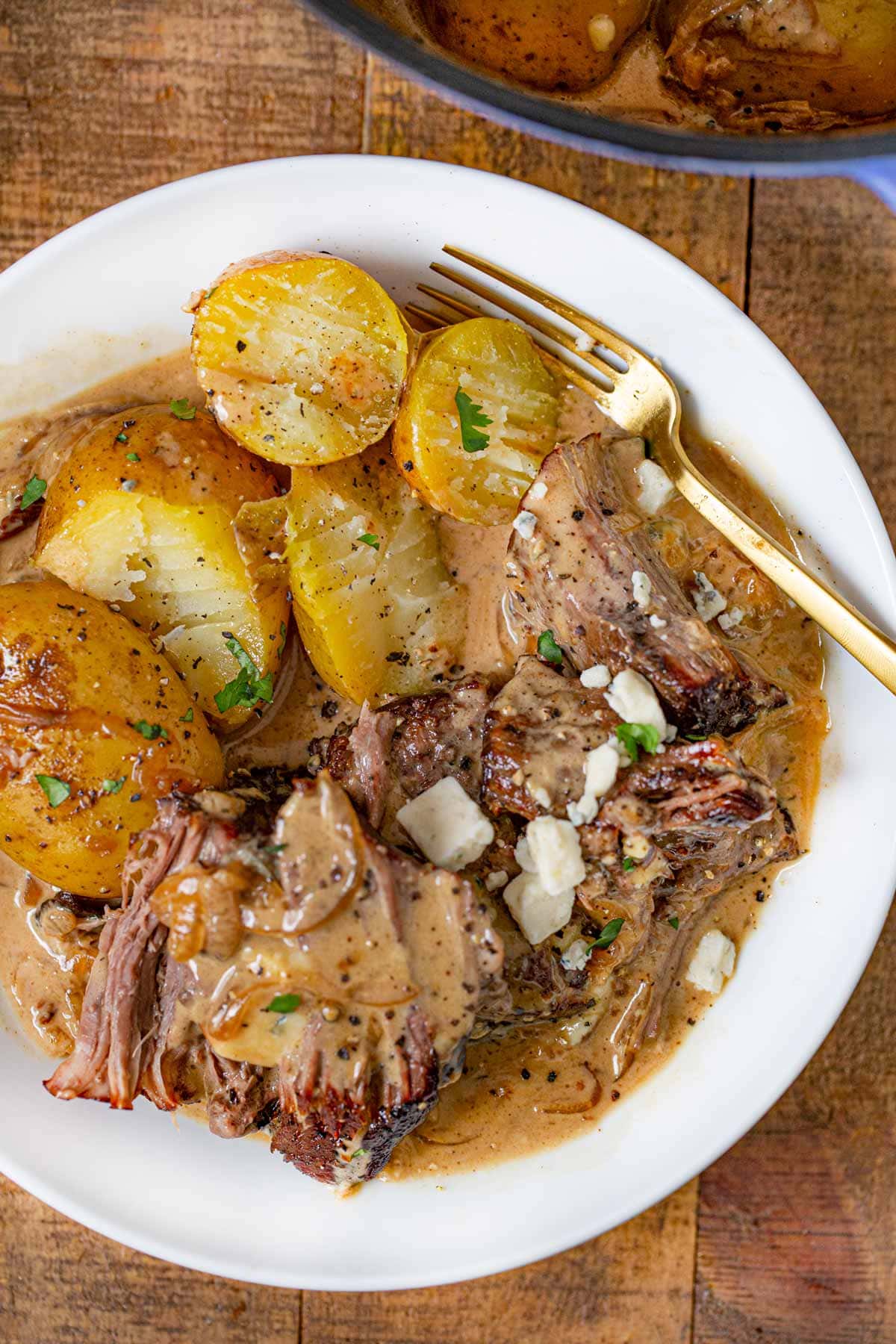 Bowl of Pot Roast with potatoes and blue cheese gravy