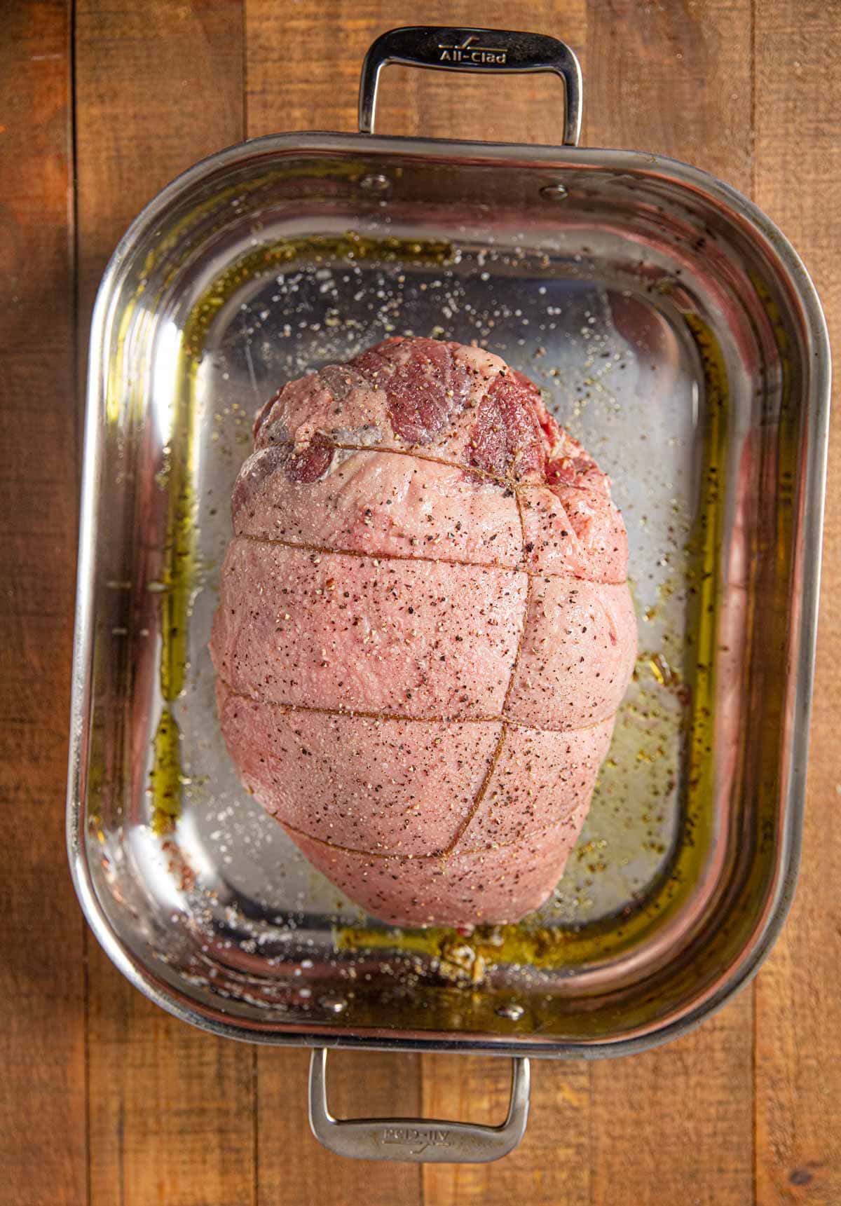 uncooked Stuffed Leg of Lamb tied in baking pan