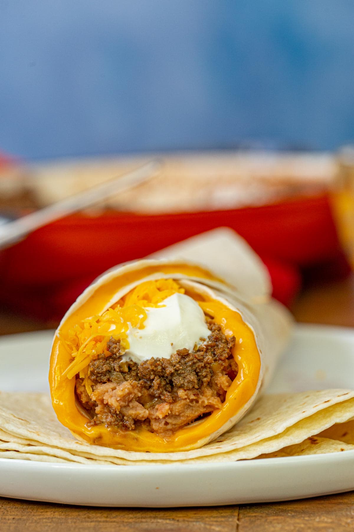 Taco Bell Beefy 5 Layer Burrito cross section on plate