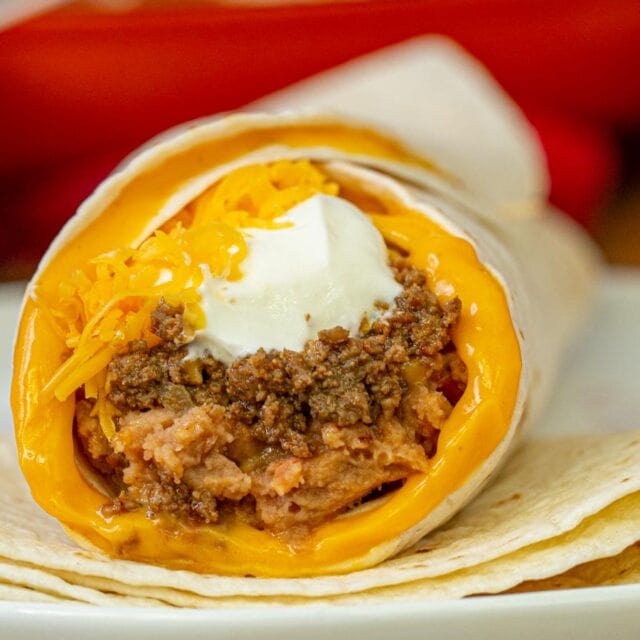 Taco Bell Beefy 5 Layer Burrito cross section on plate