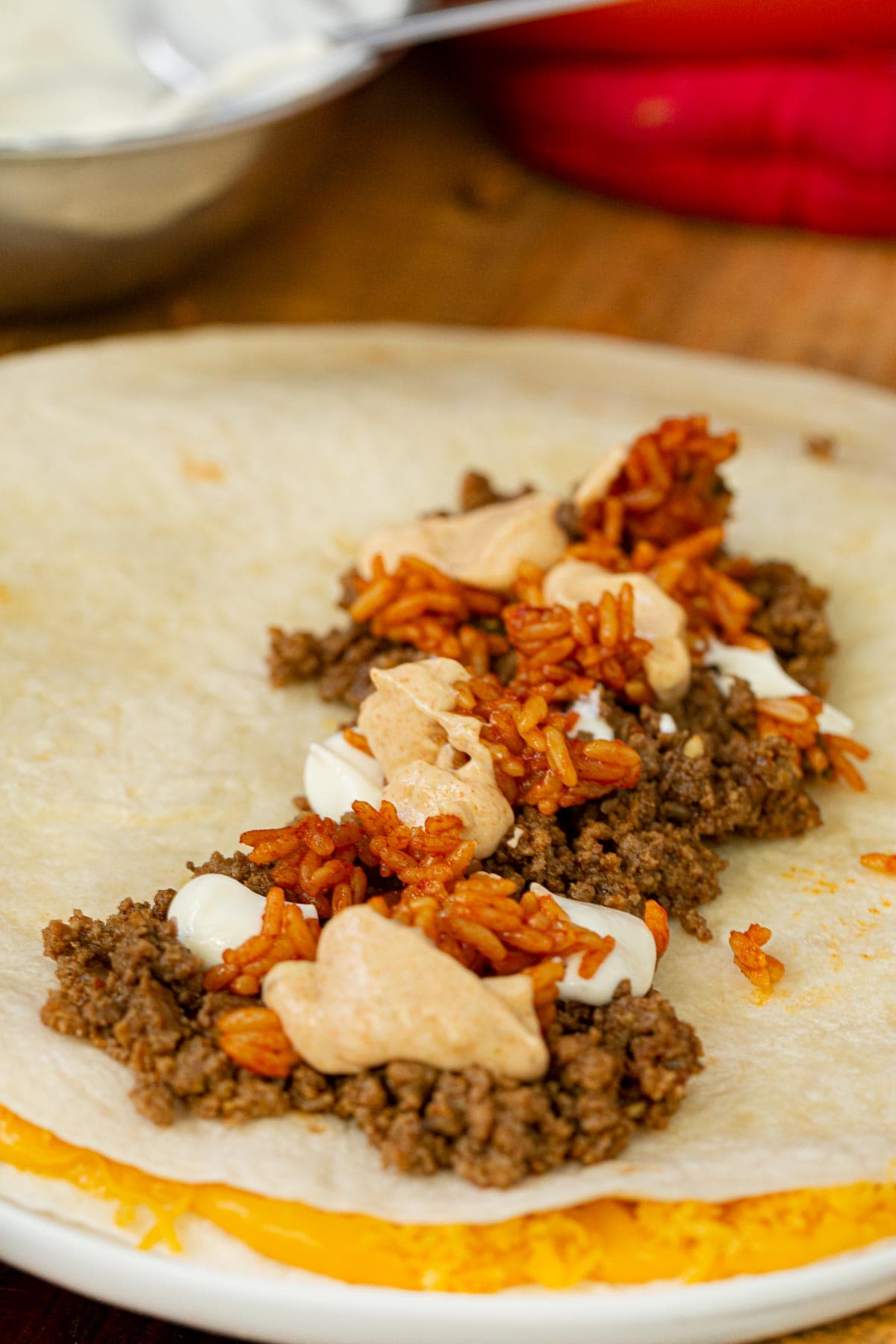 Taco Bell Quesarito ingredients on tortilla