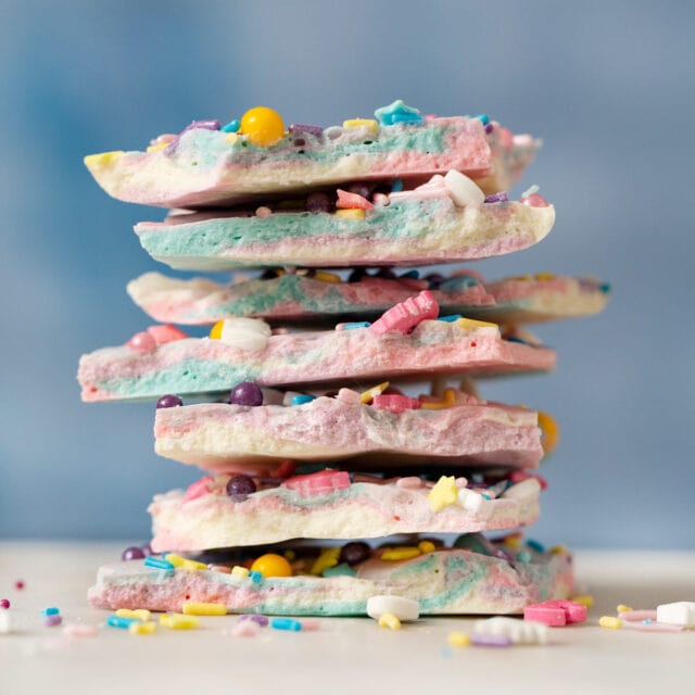 Unicorn Bark in a stack with sprinkles and a blue background