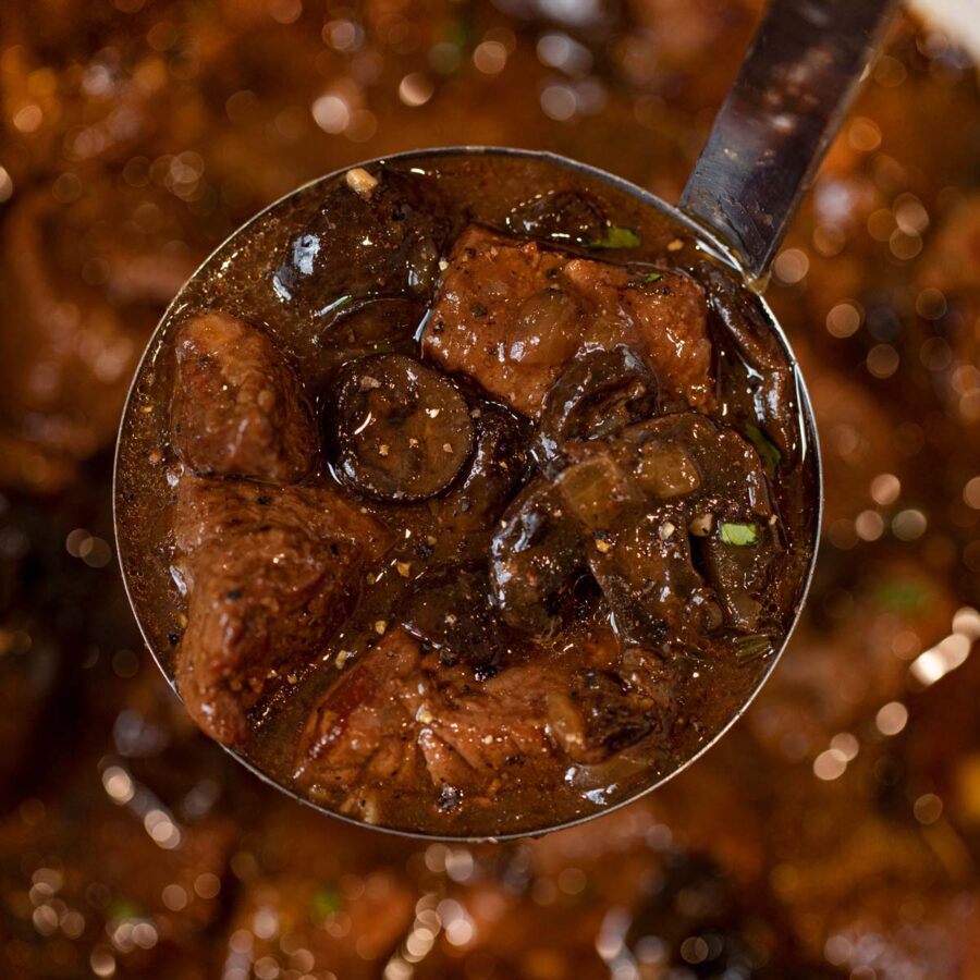 Beef and Mushroom Stew in ladle