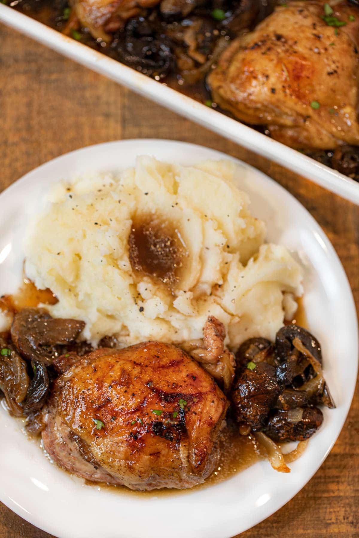 Beer Braised Chicken and Mushrooms on plate with mashed potatoes