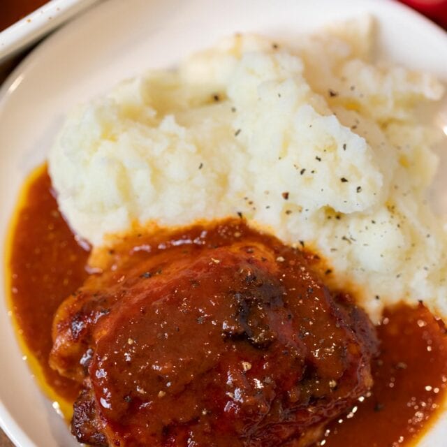 Coca-Cola Chicken in bowl with mashed potatoes