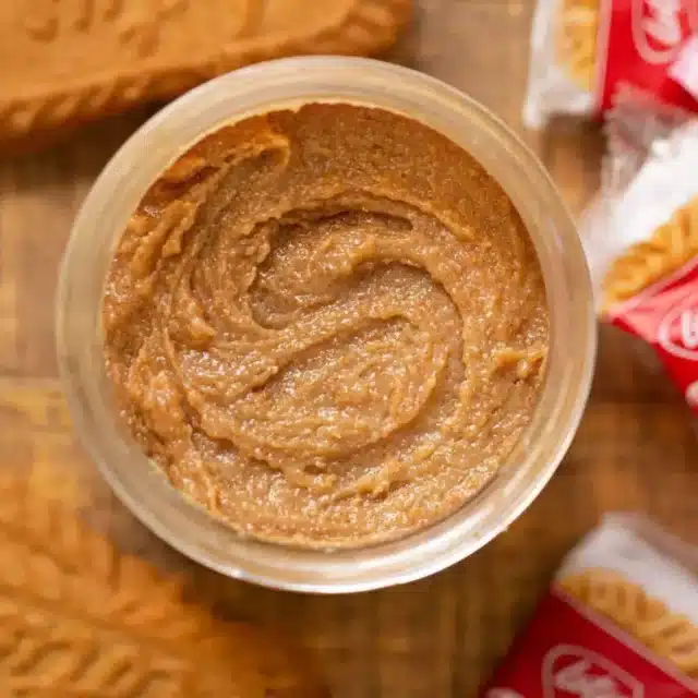butter swirled in a container with cookies next to it