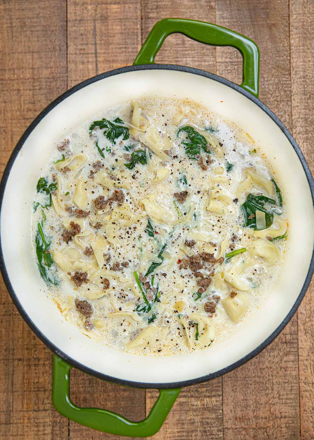 Creamy Sausage Tortellini Soup in green pot