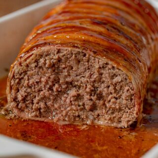 Bacon-Wrapped Meatloaf cross-section in baking dish