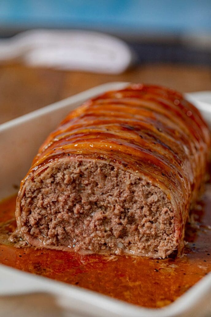 Bacon-Wrapped Meatloaf cross-section in baking dish