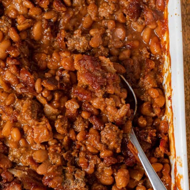 Baked Bean Casserole in baking dish with serving spoon 1x1
