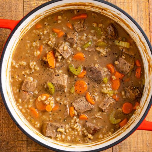 cooked in orange dutch oven on wooden counter.