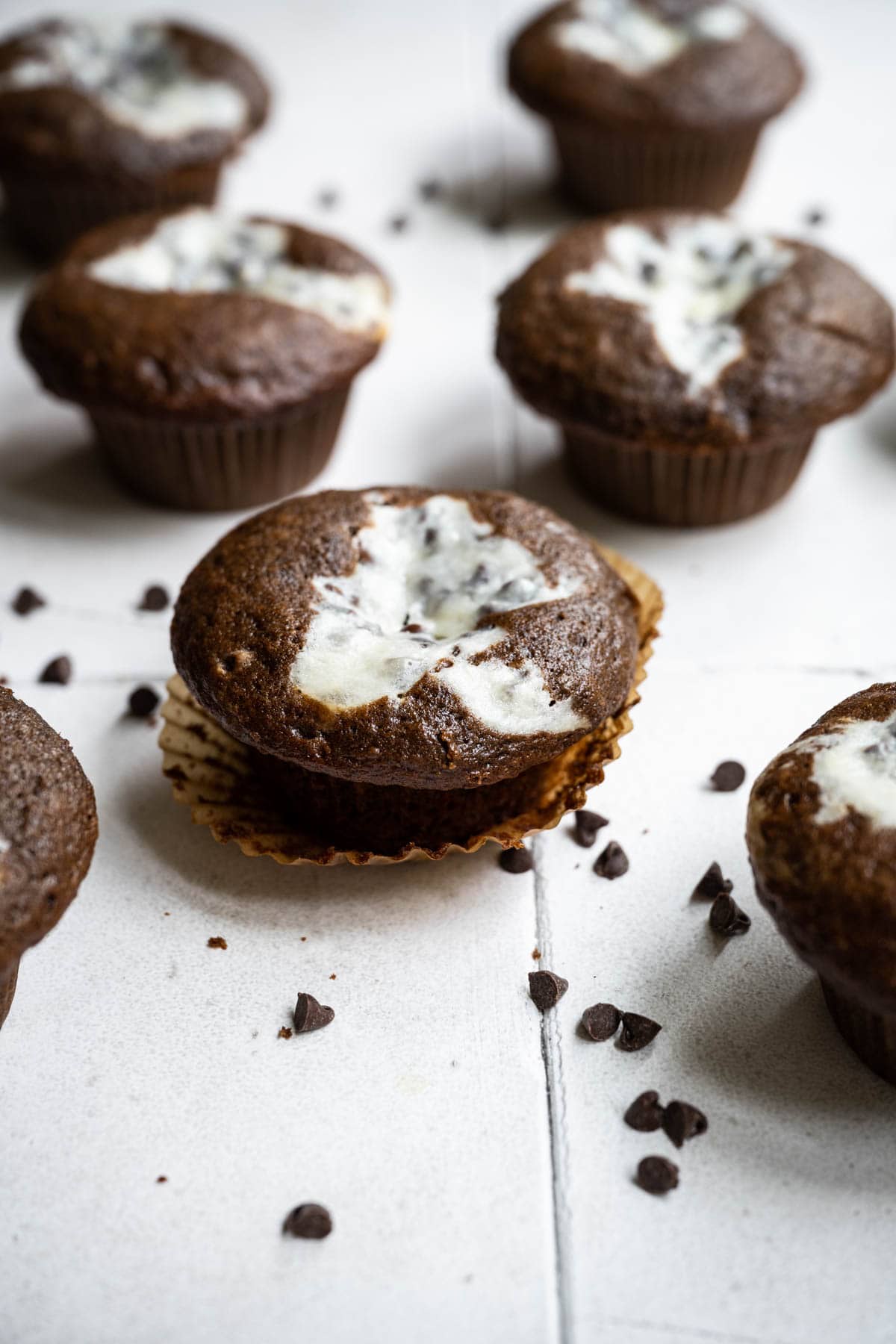 Black Bottom Cupcakes on counter with chocolate chips