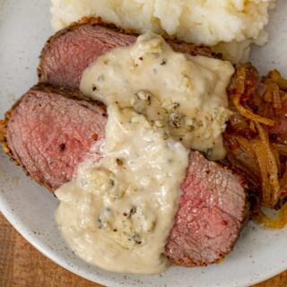 Sauce over steak on plate 1x1