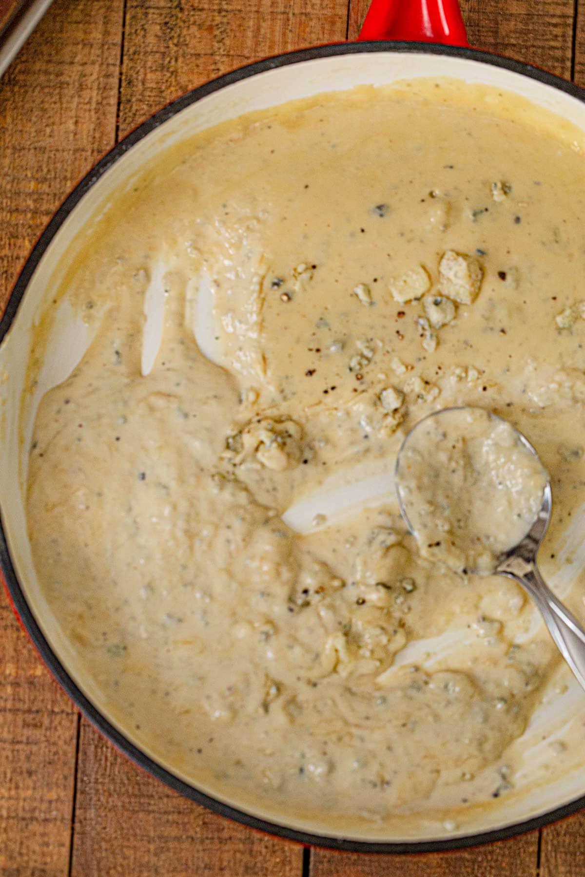 Blue Cheese Sauce in skillet with spoon