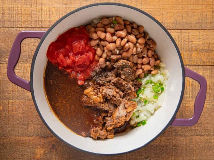 Ingredients for baked beans in pot in segments