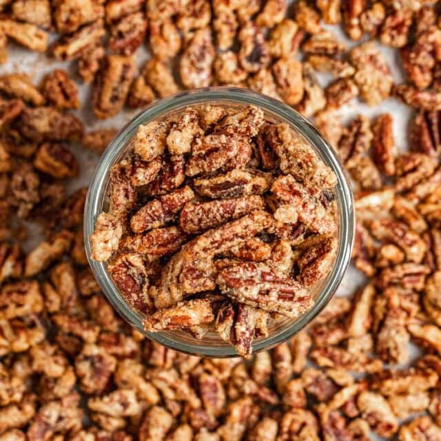Candied Pecans on baking dish with glass bowl