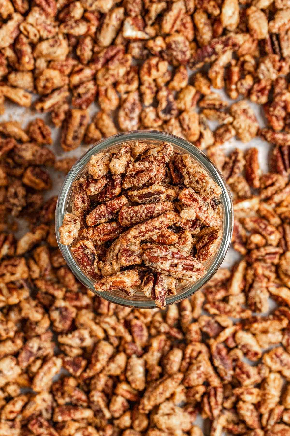 Candied Pecans on baking dish with glass bowl