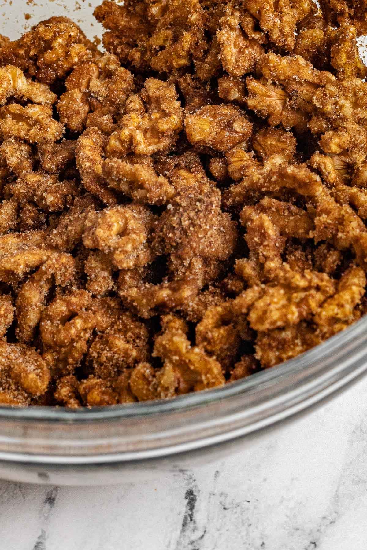 Candied Walnuts coated in sugar mixture in bowl