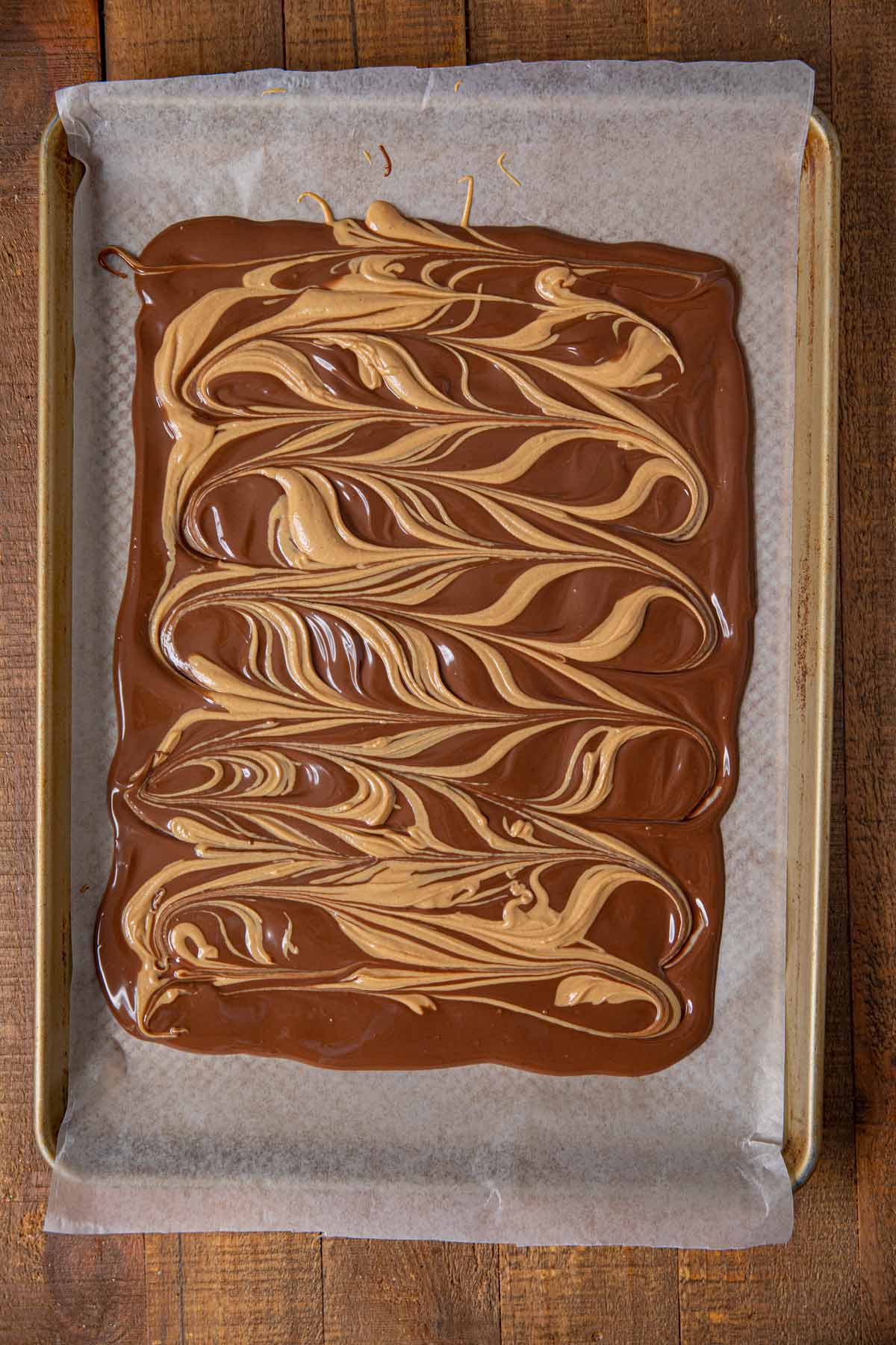 Chocolate Peanut Butter Bark on baking sheet before cooling