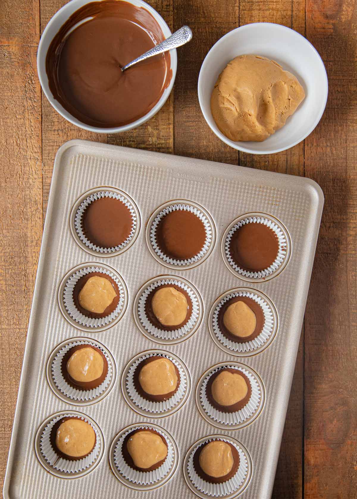 Chocolate Peanut Butter Cups chocolate and peanut butter in cupcake tin