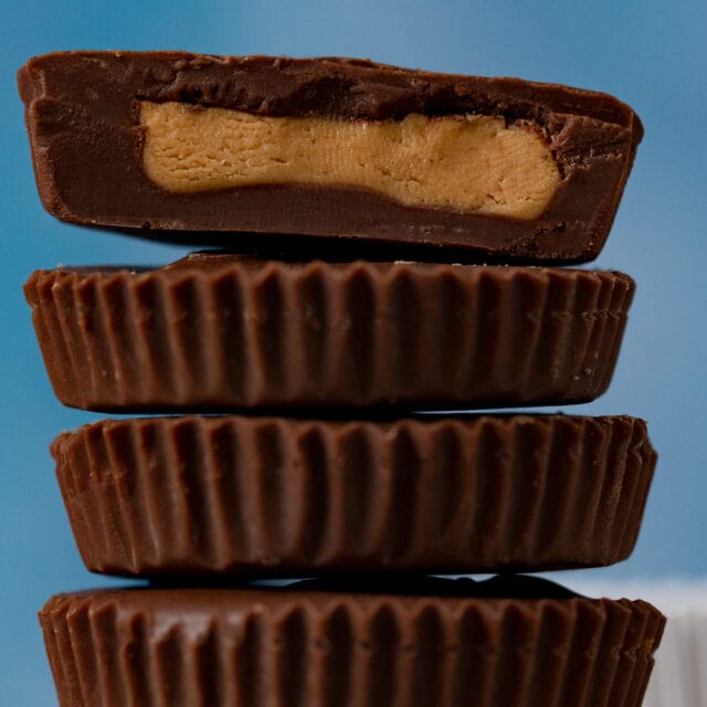 Brownish candy in stack with the top one cut in half