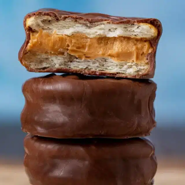 Stack of cookies with top cookie having a bite taken out