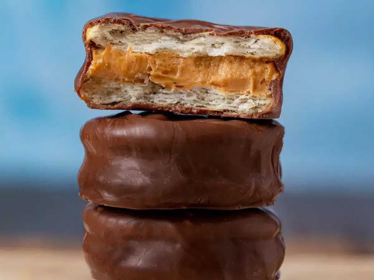 Stack of cookies with top cookie having a bite taken out