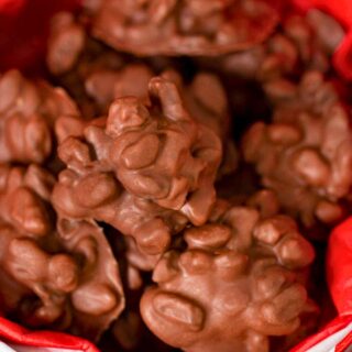 Chocolate raisins in a gift box with red parchment paper