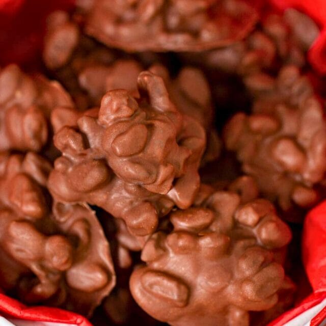 Chocolate raisins in a gift box with red parchment paper