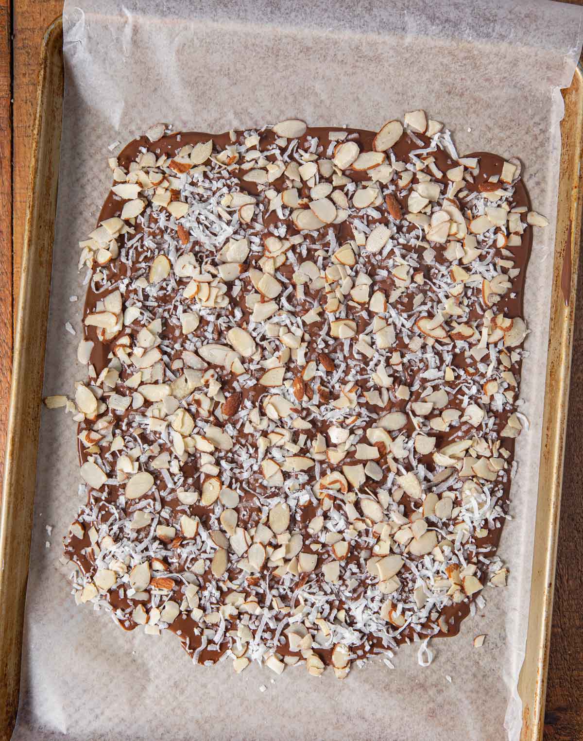 top-down view of Coconut Almond Chocolate Bark in baking pan