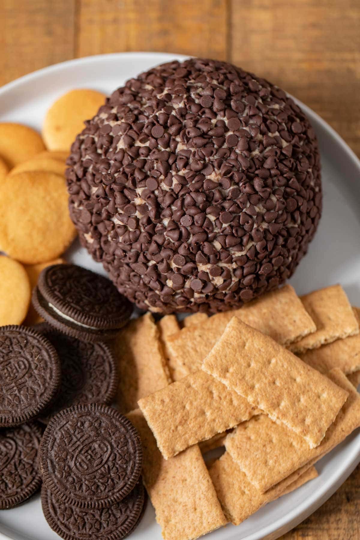 Cookie Dough Cheese Ball on plate with assorted cookies