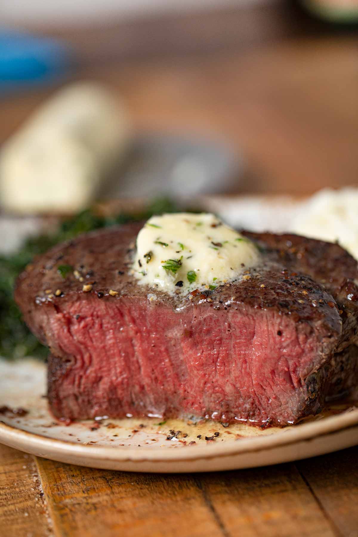 Filet Mignon on plate with garlic herb butter