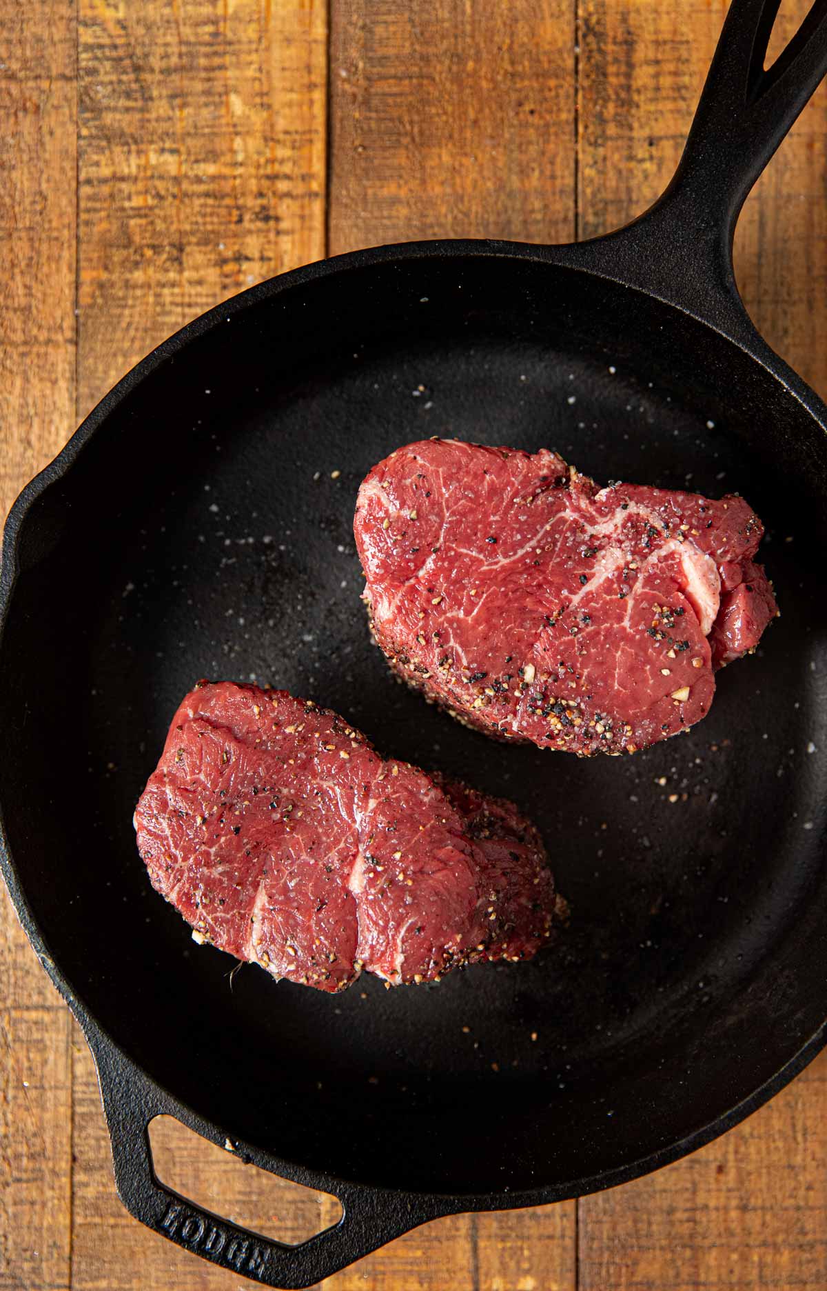 Filet Mignon in cast iron skillet before cooking