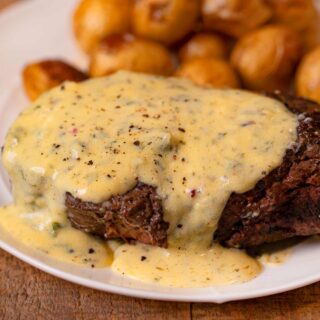Filet with Bernaise Sauce on plate with roasted potatoes