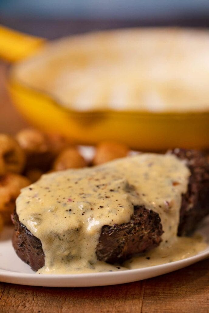 Filet with Bernaise Sauce on plate with roasted potatoes