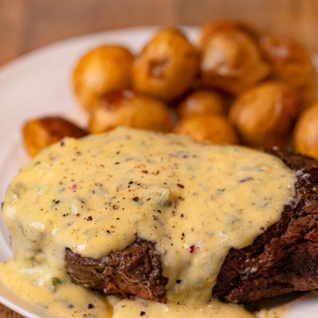 Filet with Bernaise Sauce on plate with roasted potatoes