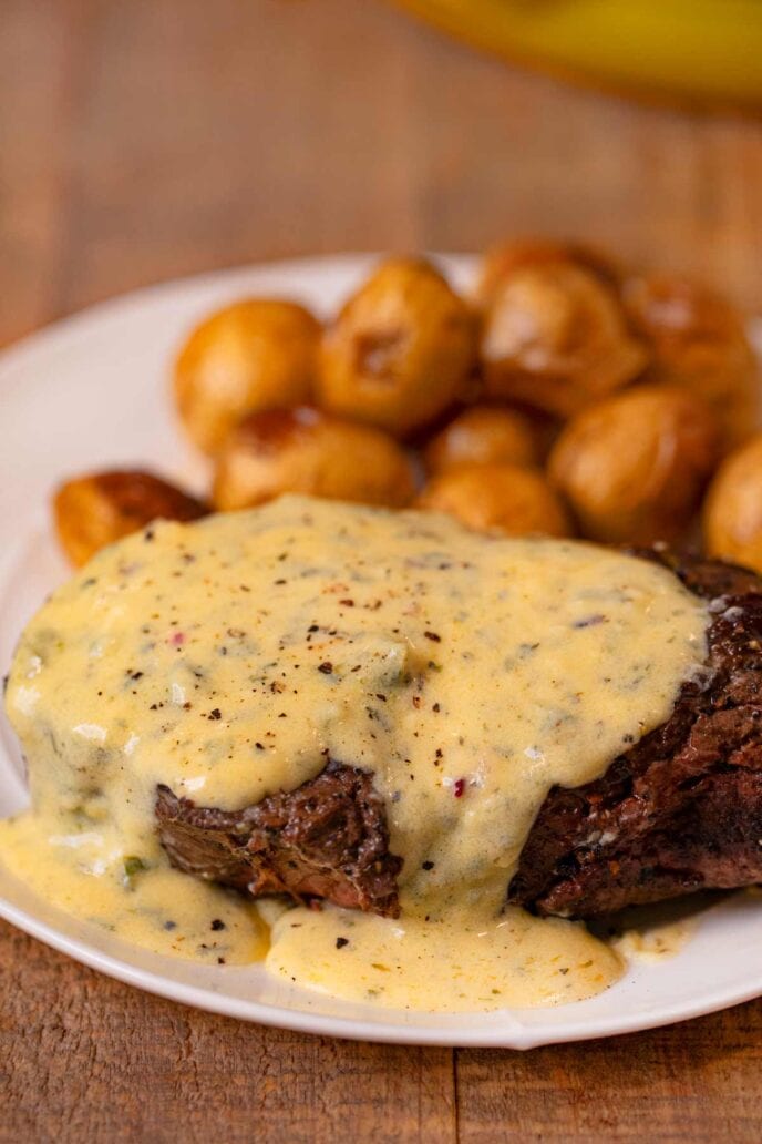 Filet with Bernaise Sauce on plate with roasted potatoes