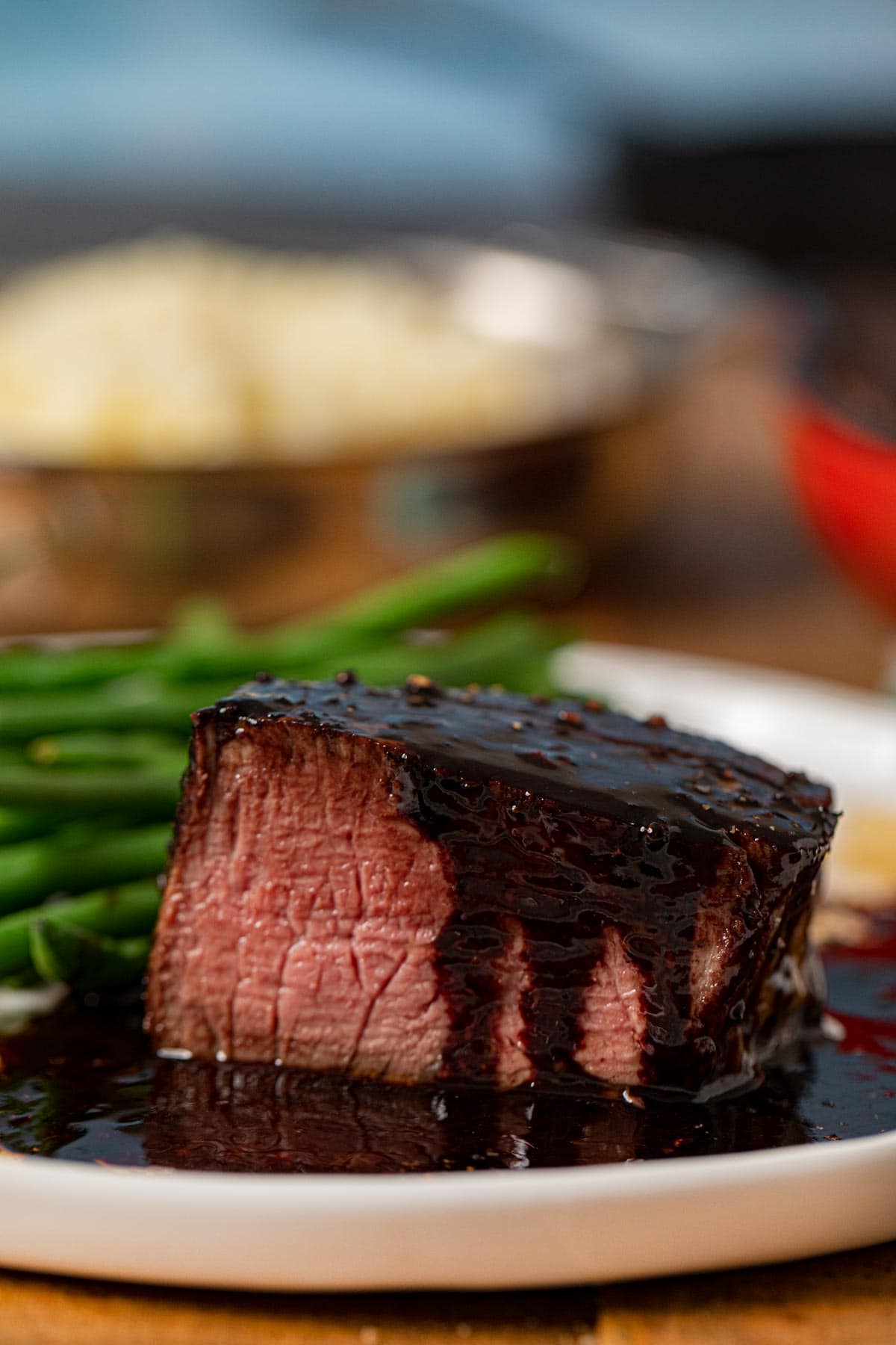 Filet with Red Wine Reduction on plate with green beans