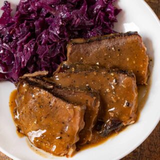 German Sauerbraten on plate with German cabbage