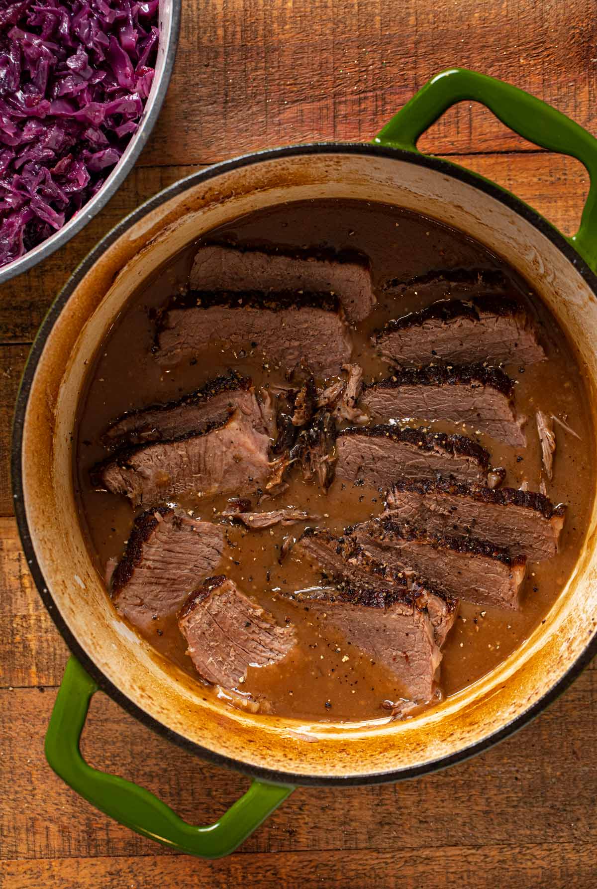 German Sauerbraten in pot, cut into slices