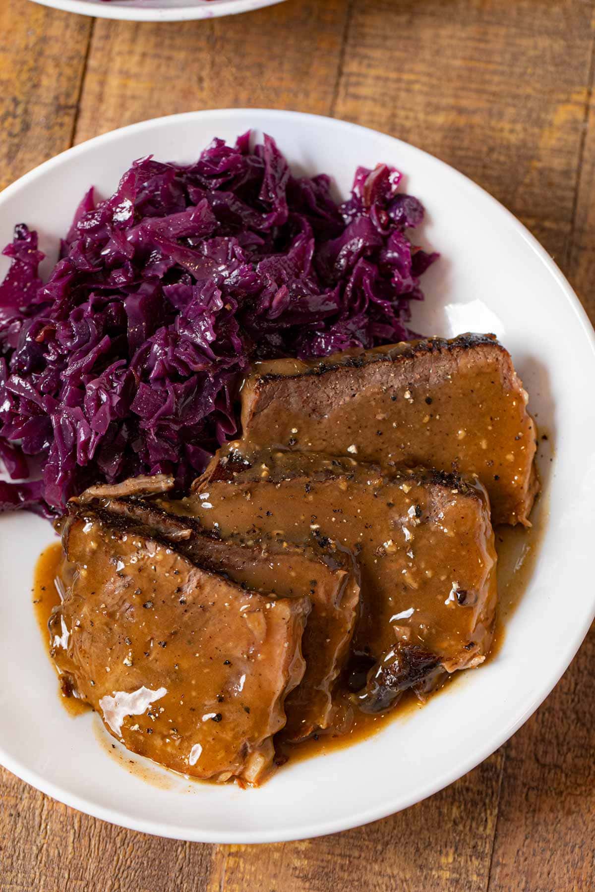 German Sauerbraten on plate with German cabbage