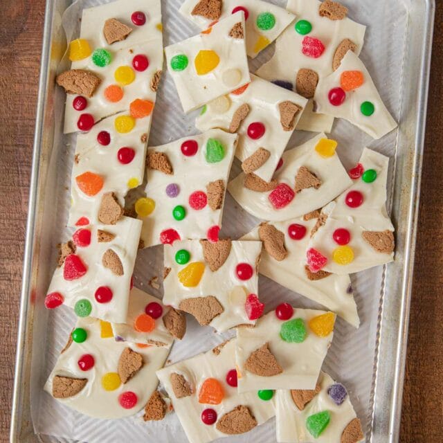Gingerbread House Candy Bark pieces on baking sheet