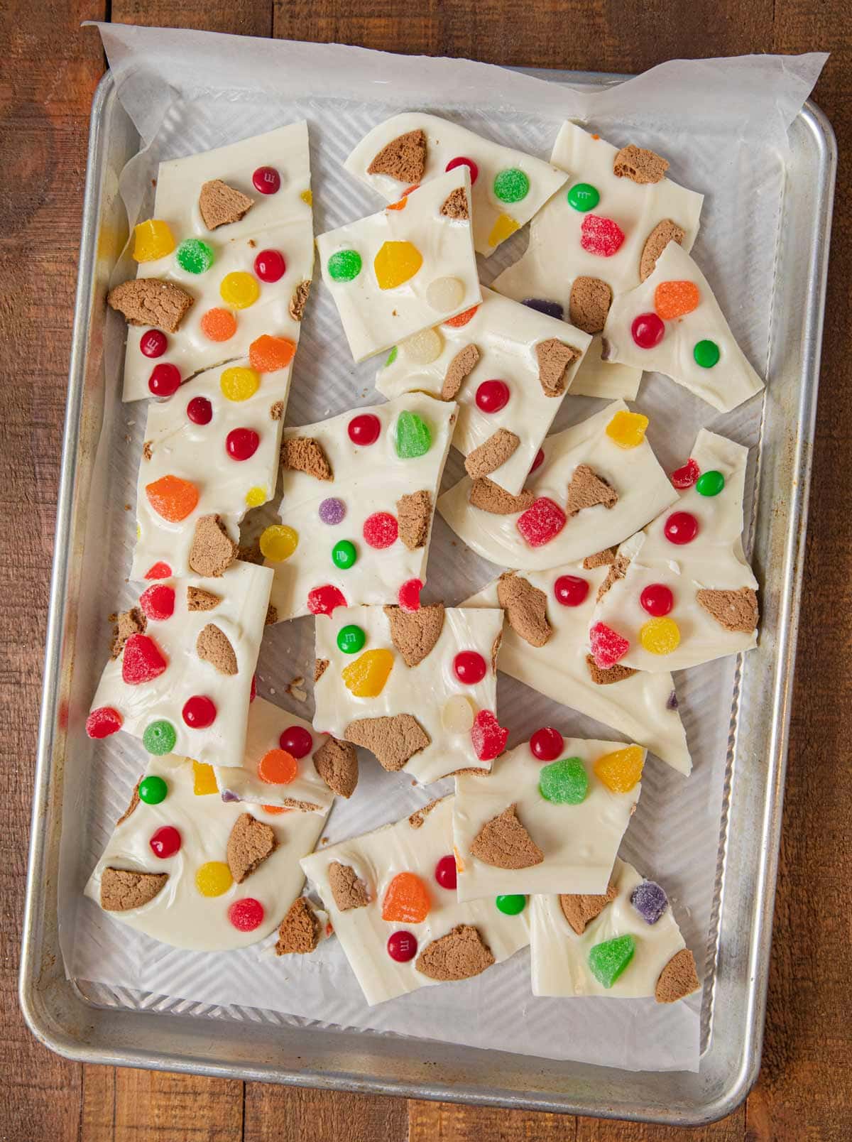 Gingerbread House Candy Bark pieces on baking sheet