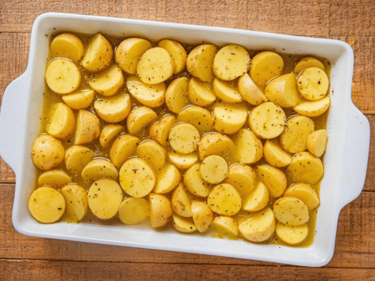 Potatoes in baking dish ready to cook