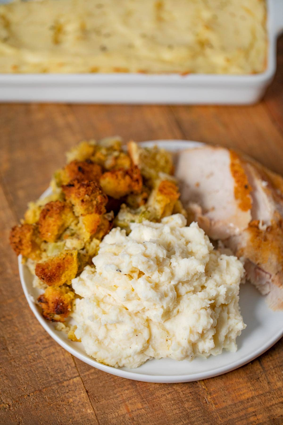 Make-Ahead Mashed Potatoes on plate with turkey and stuffing