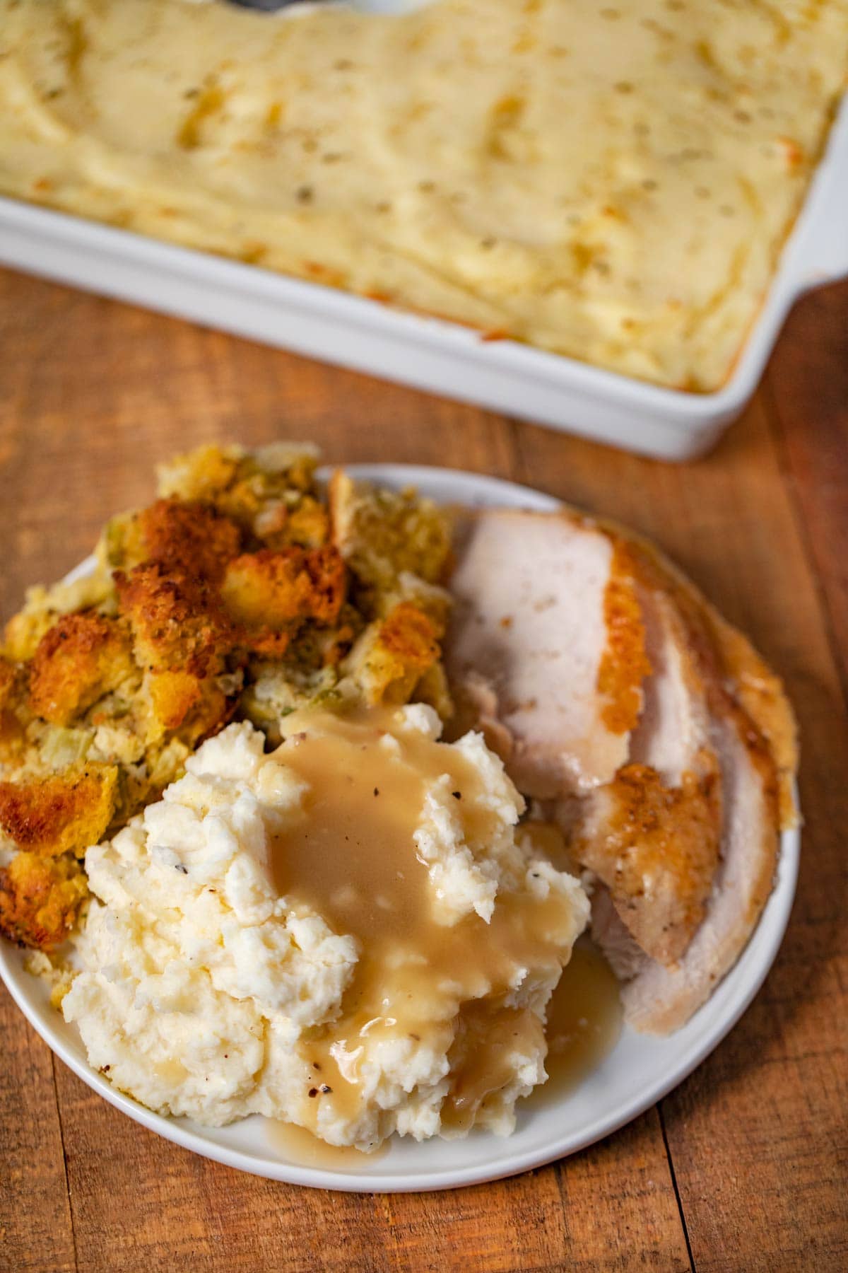 Make-Ahead Turkey Gravy served over mashed potatoes on plate