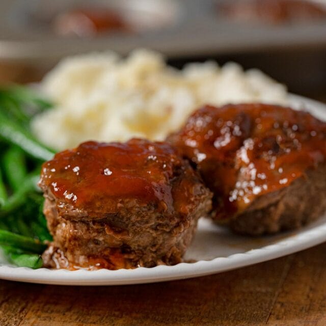 Meatloaf Muffins on plate with mashed potatoes and green beans