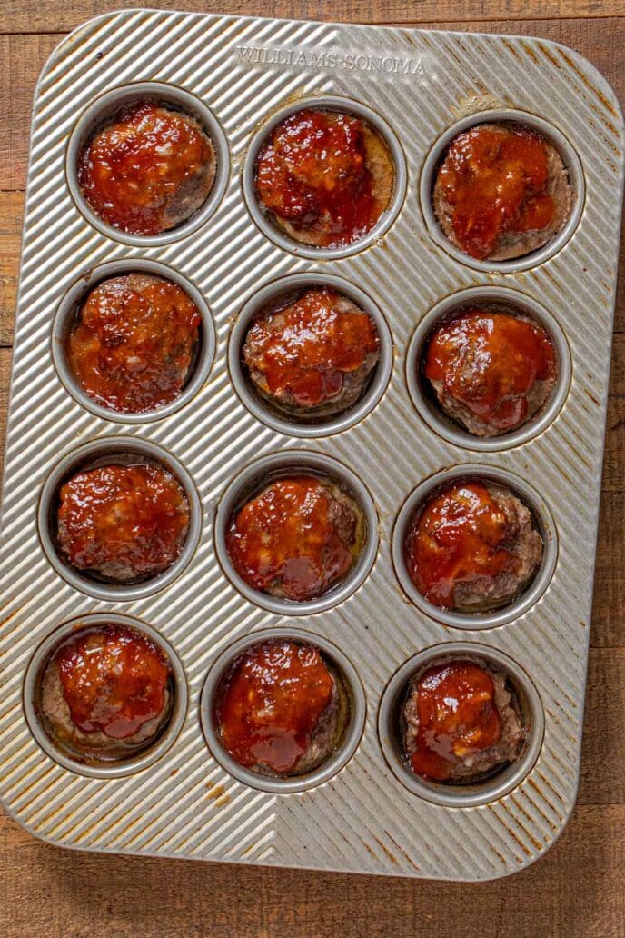 Meatloaf Muffins in muffin tin with ketchup glaze