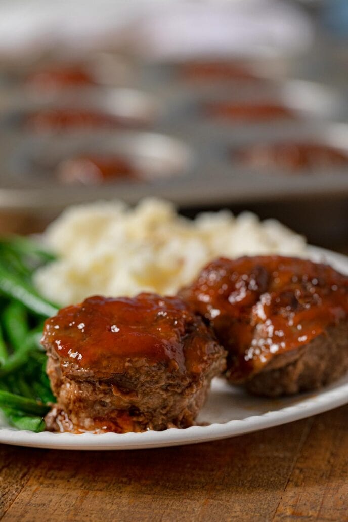 Meatloaf Muffins on plate with mashed potatoes and green beans